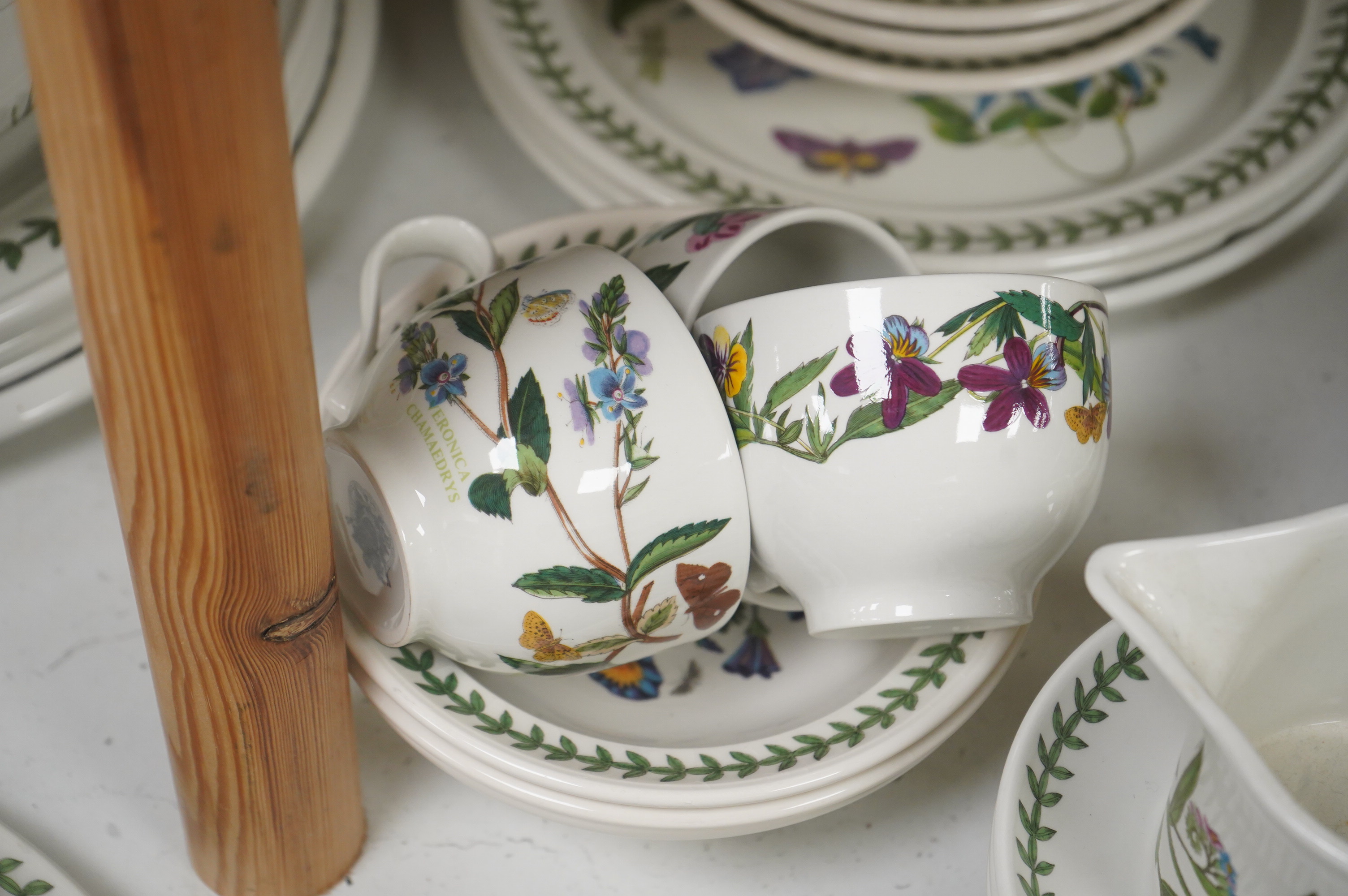 A large quantity of Portmerion Botanic Garden dinner and tea wares to include graduated bowls, dinner plates and side plates